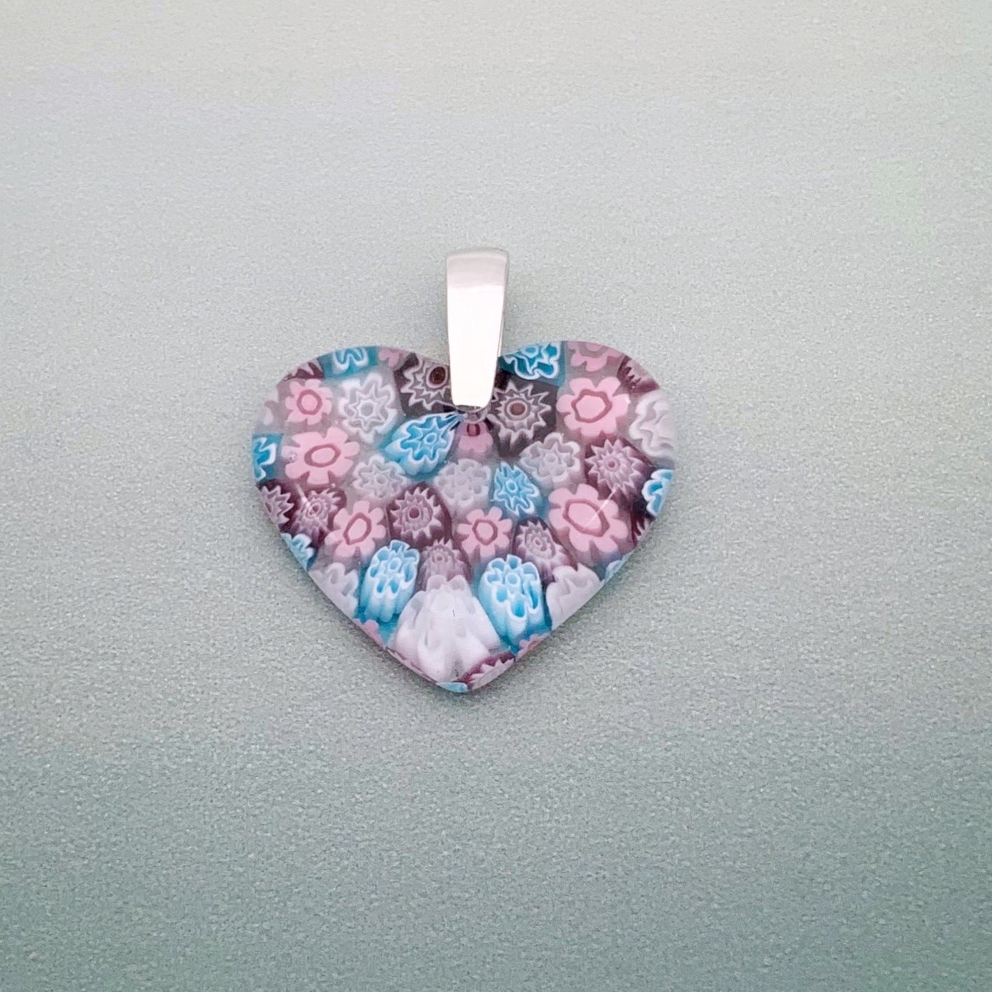 Fused millefiori glass heart pendant in blossom fleurette