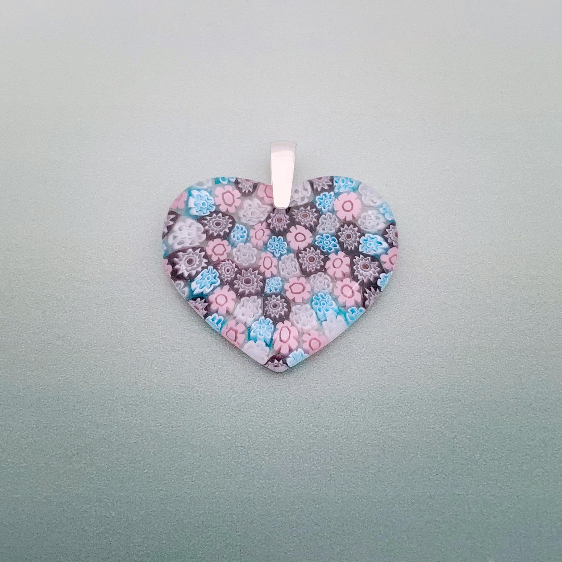 Fused millefiori glass heart pendant in blossom fleurette