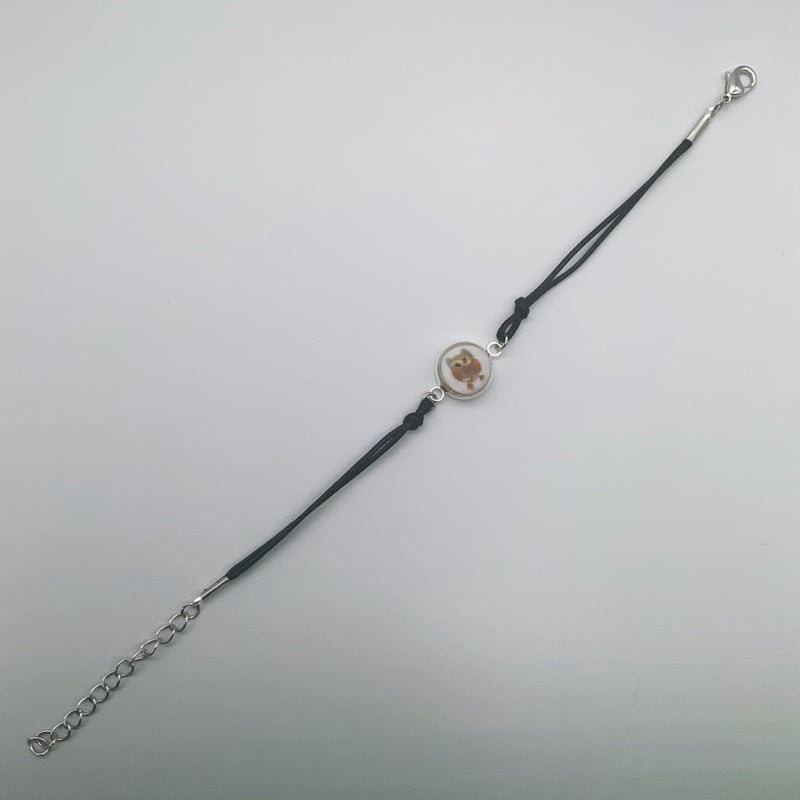 Black rope bracelet with glass owl centre piece