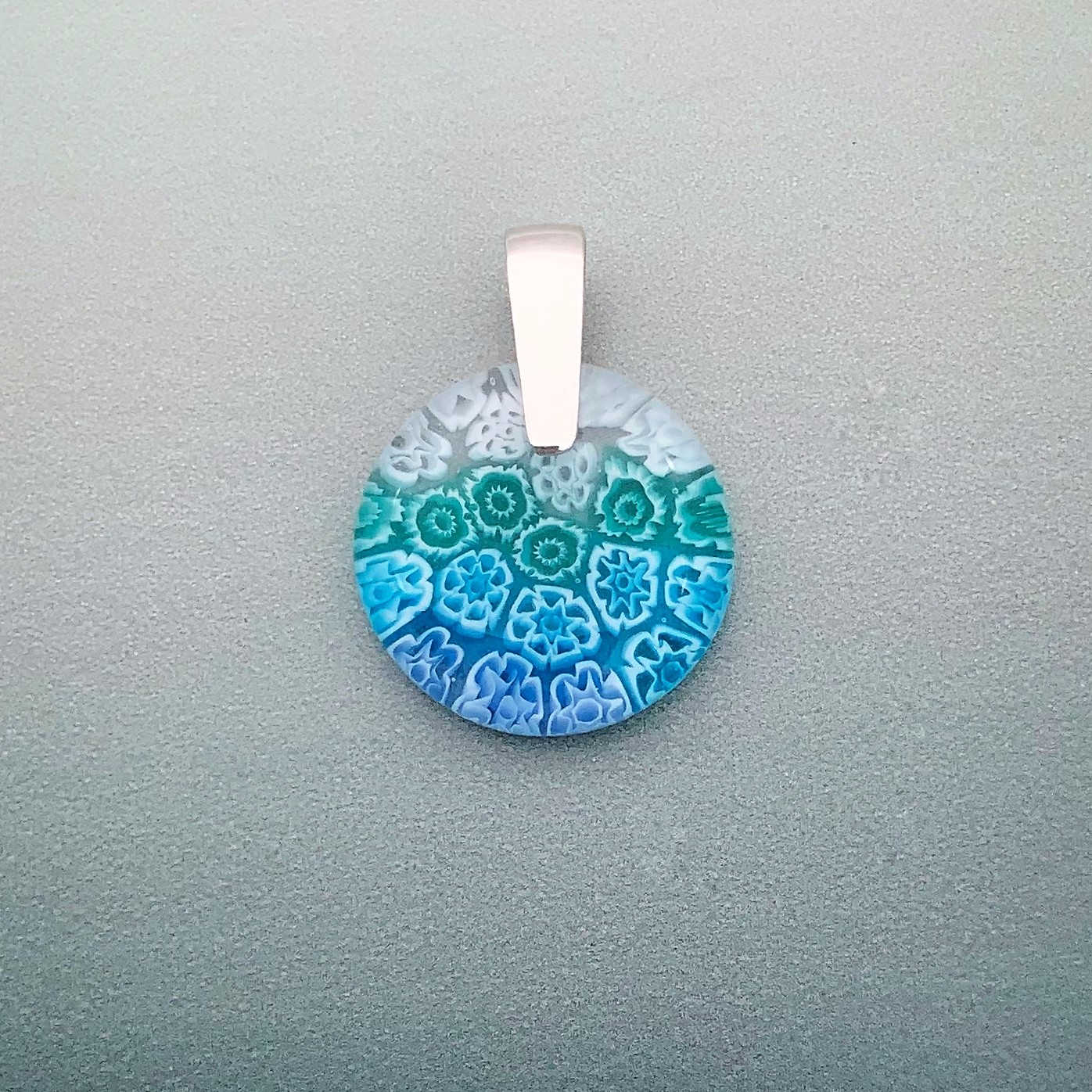 Fused Millefiori glass 24mm round pendant in aqua cascade fleurettes