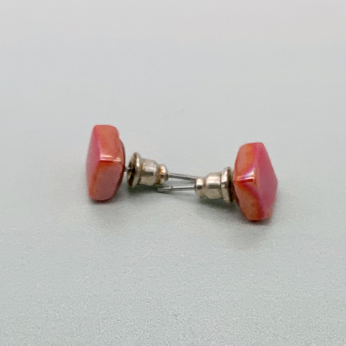 Square spot studs in coral glass