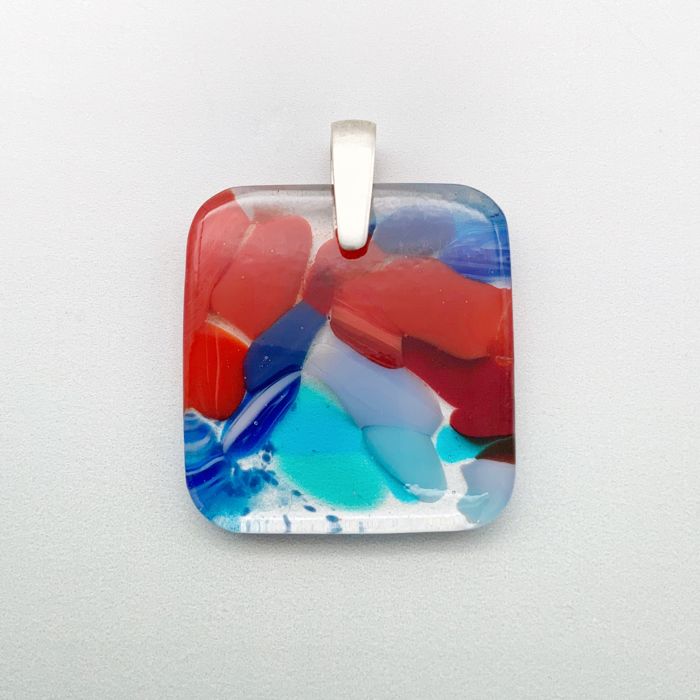 Designer Murrini fused glass square pendant with a short silver pinch bail