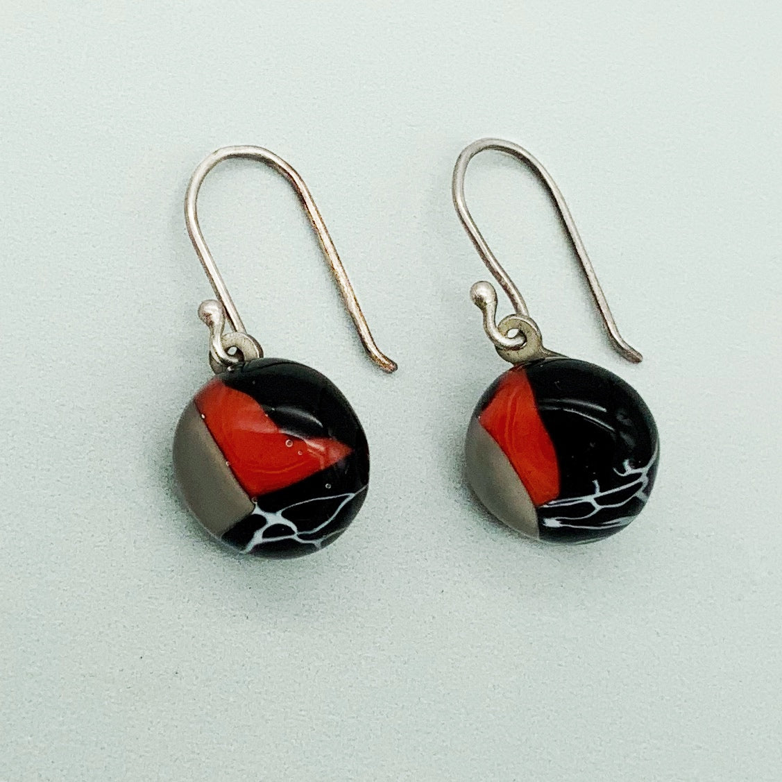 Contemporary round glass dangle earrings in black, red and white