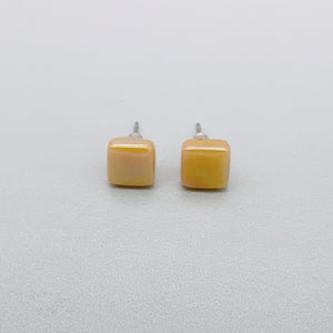 Square spot studs in mustard glass