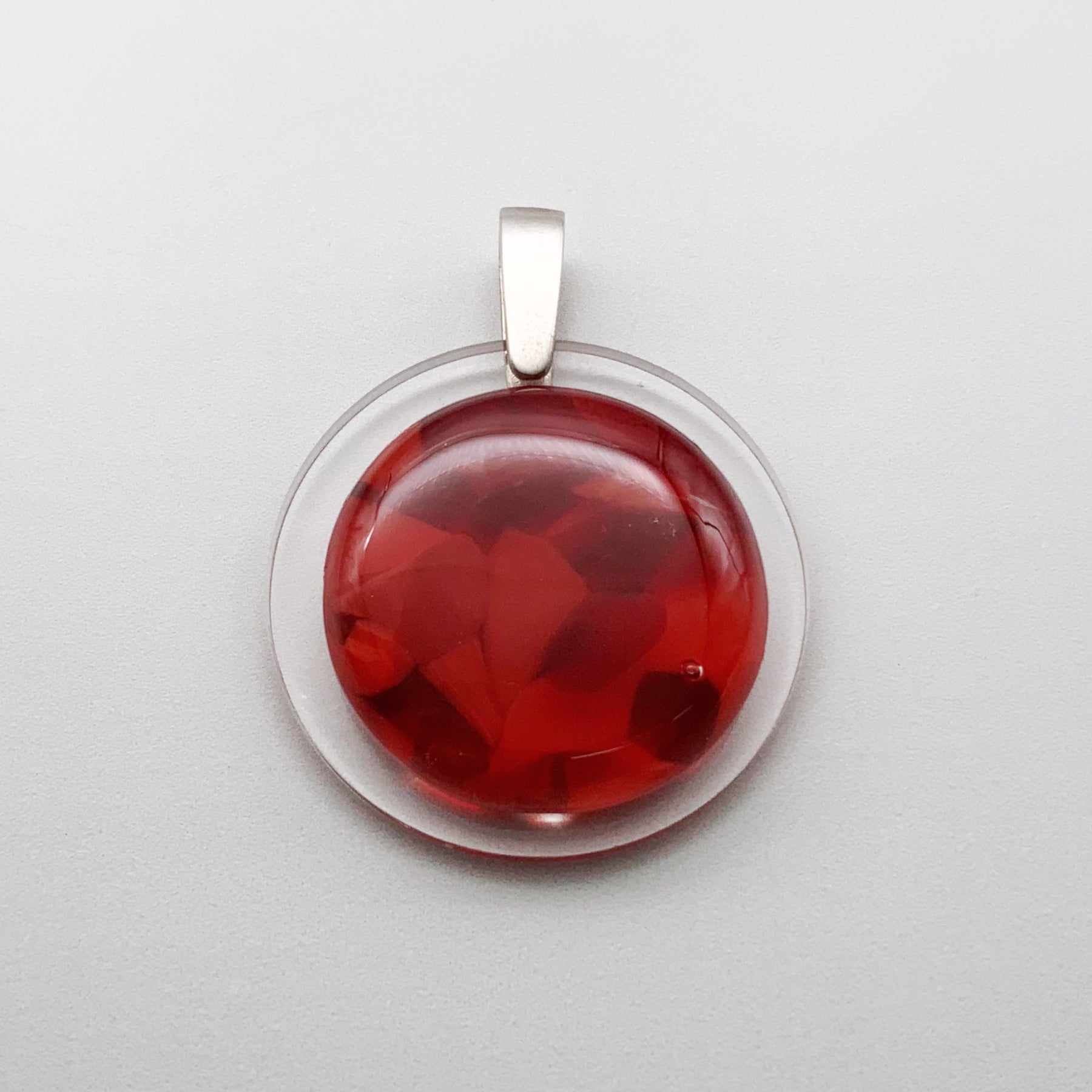 Red Murrini 35mm glass pendant on perspex