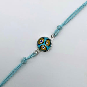Turquoise bracelets with a mixed selection of glass centers