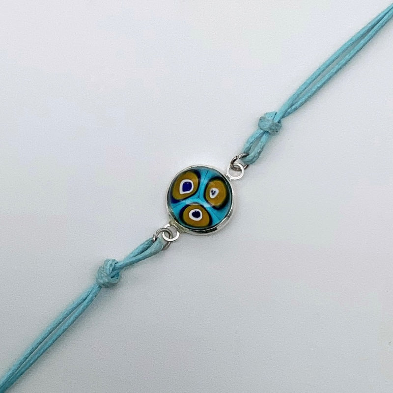 Turquoise bracelets with a mixed selection of glass centers