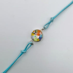Turquoise bracelets with a mixed selection of glass centers