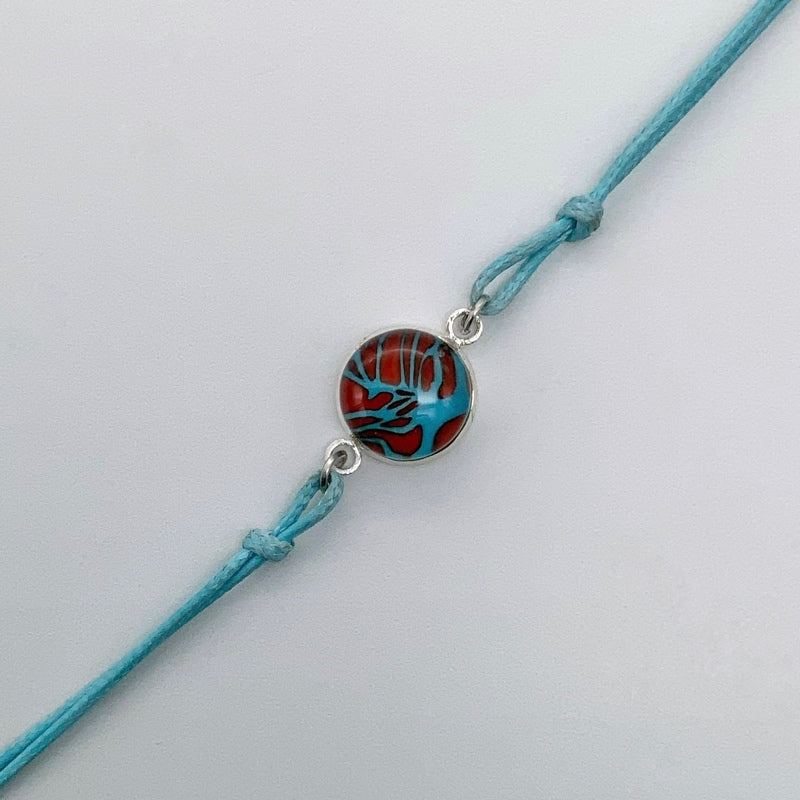Turquoise bracelets with a mixed selection of glass centers