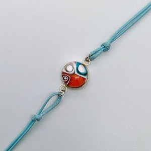 Turquoise bracelets with a mixed selection of glass centers