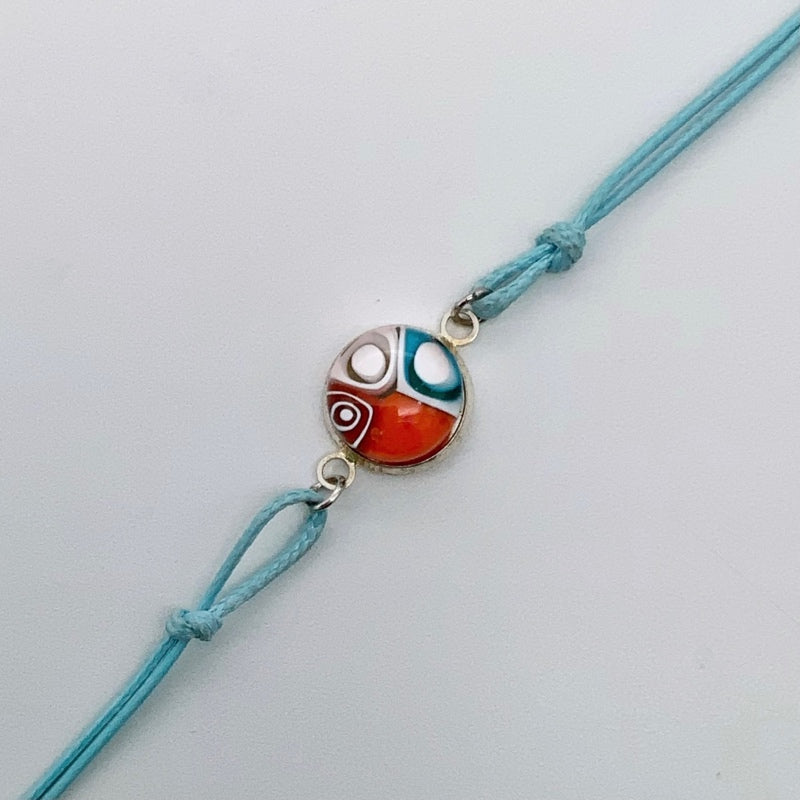 Turquoise bracelets with a mixed selection of glass centers