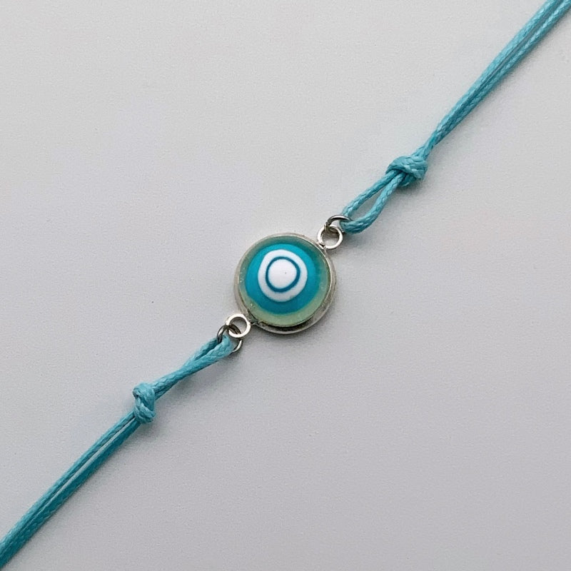 Turquoise bracelets with a mixed selection of glass centers