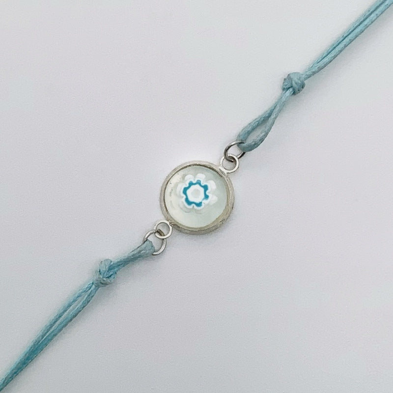 Turquoise bracelets with a mixed selection of glass centers