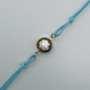 Turquoise bracelets with a mixed selection of glass centers