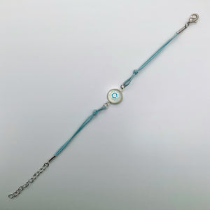 Turquoise bracelets with a mixed selection of glass centers