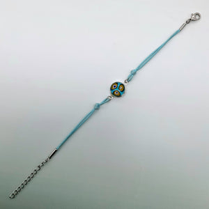 Turquoise bracelets with a mixed selection of glass centers