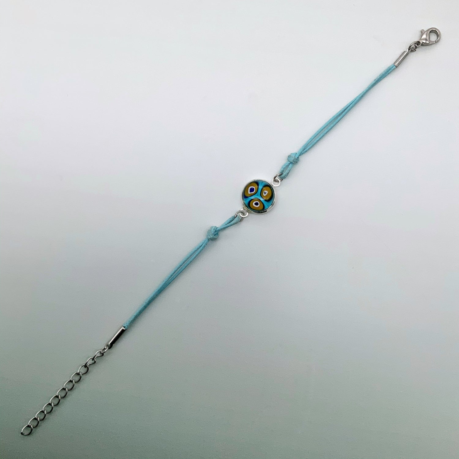 Turquoise bracelets with a mixed selection of glass centers