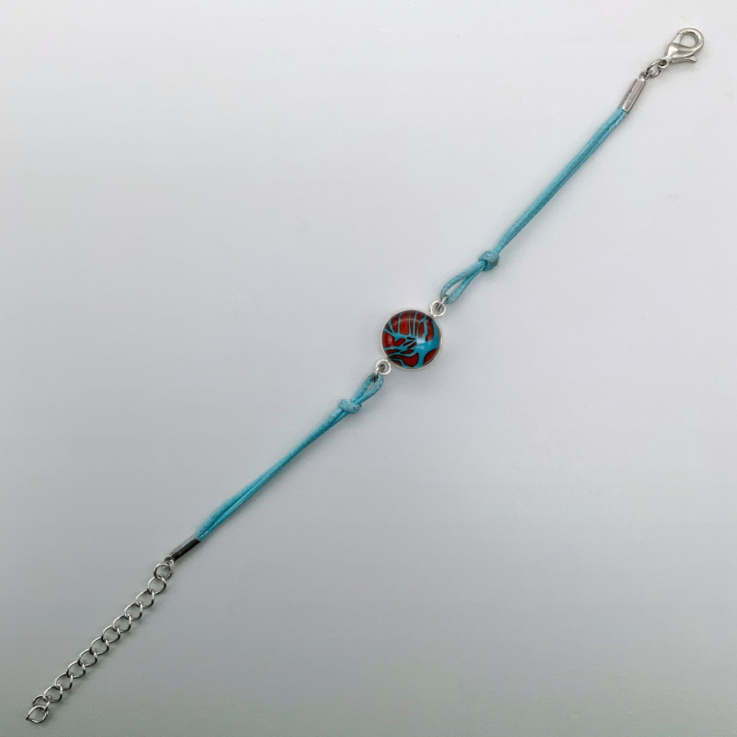 Turquoise bracelets with a mixed selection of glass centers