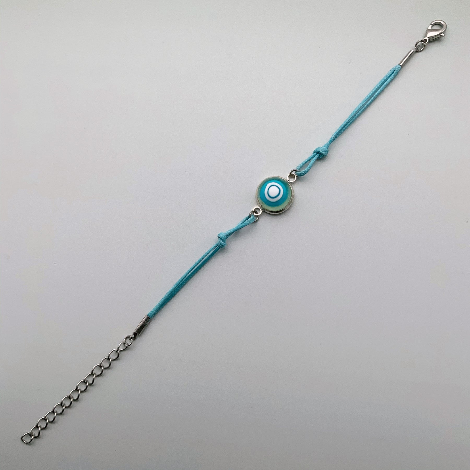Turquoise bracelets with a mixed selection of glass centers