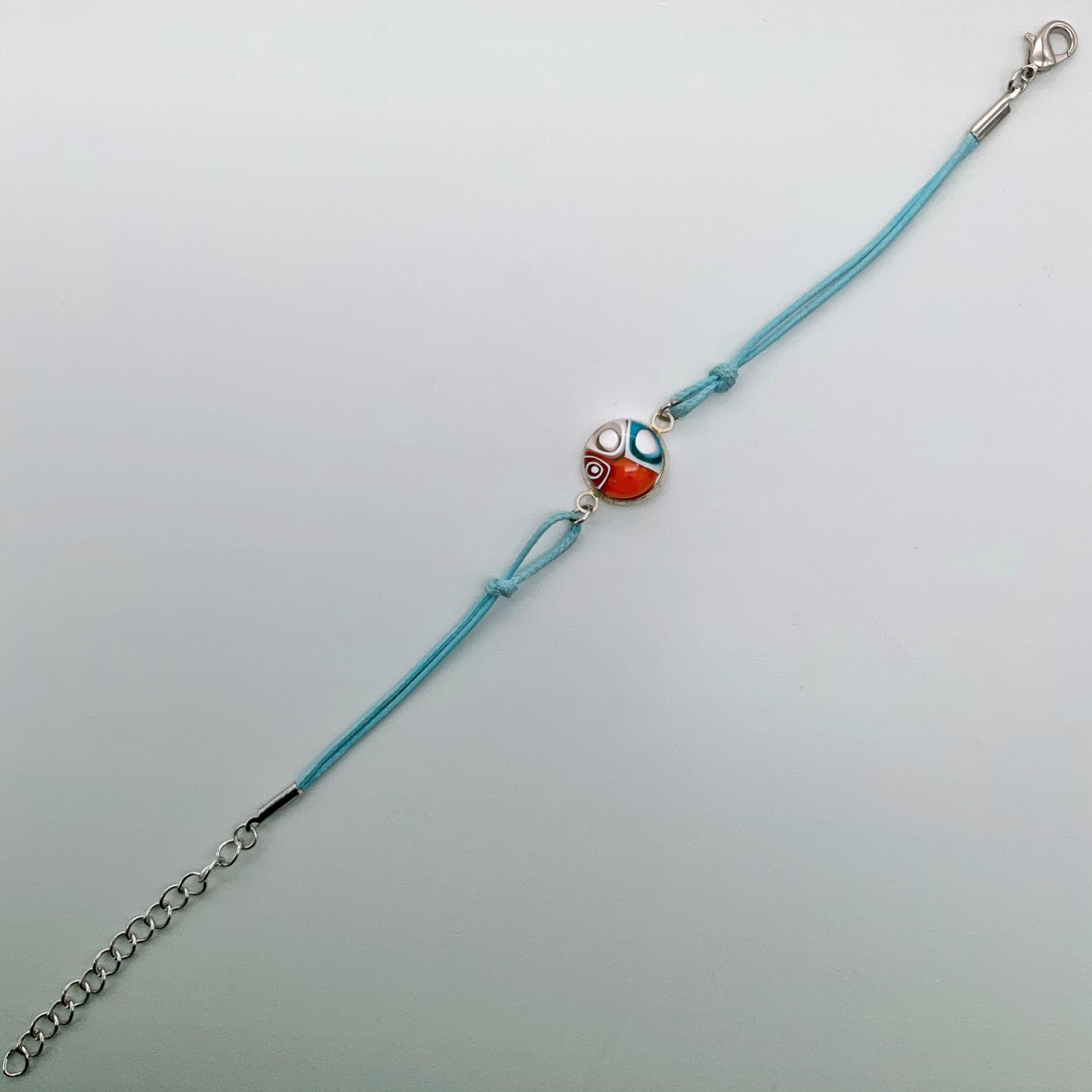 Turquoise bracelets with a mixed selection of glass centers