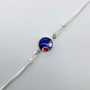 White bracelets with a mix of glass centers