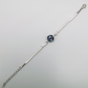 White bracelets with a mix of glass centers