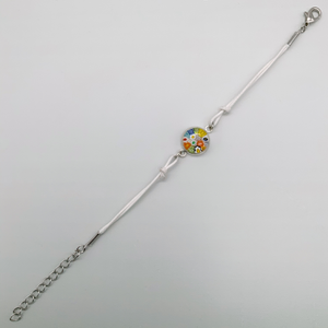 White bracelets with a mix of glass centers