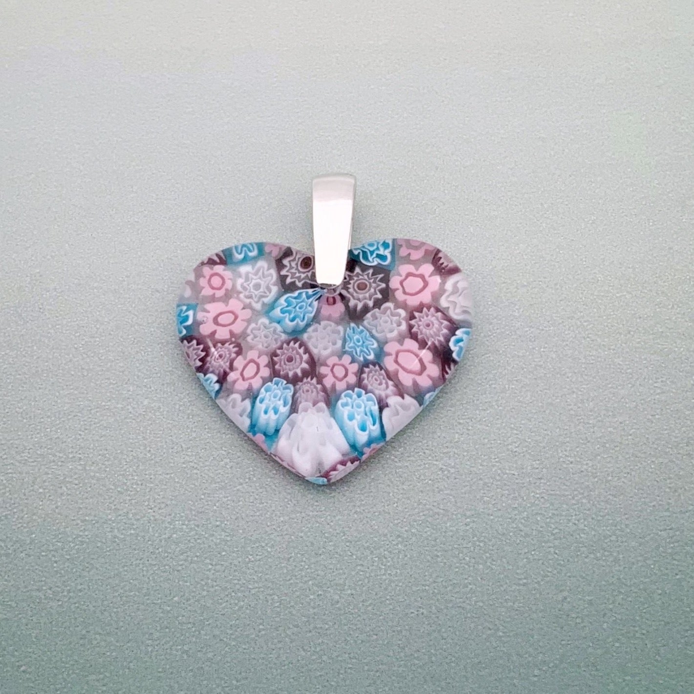 Fused millefiori glass heart pendant in blossom fleurette