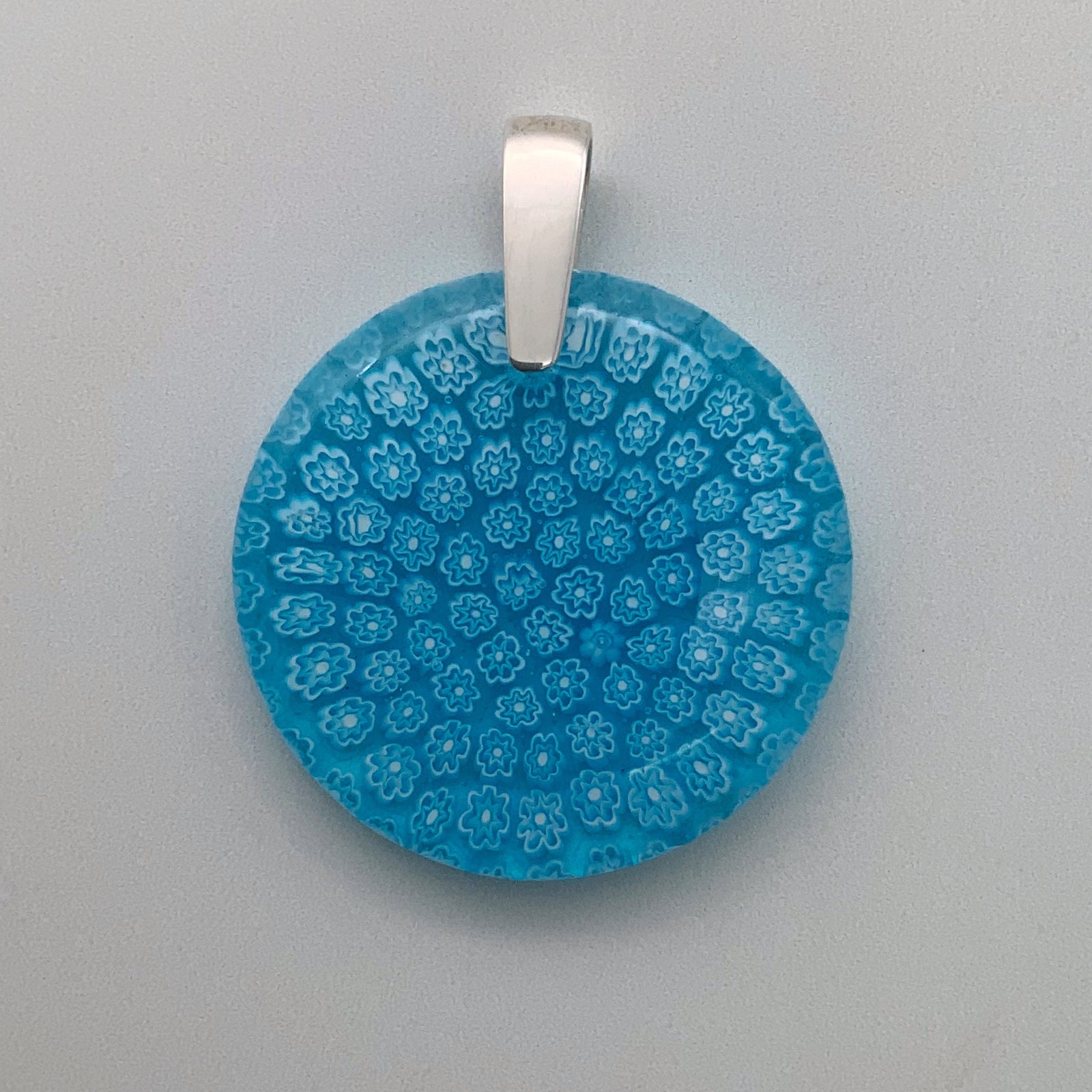 Round turquoise fleurette glass pendant