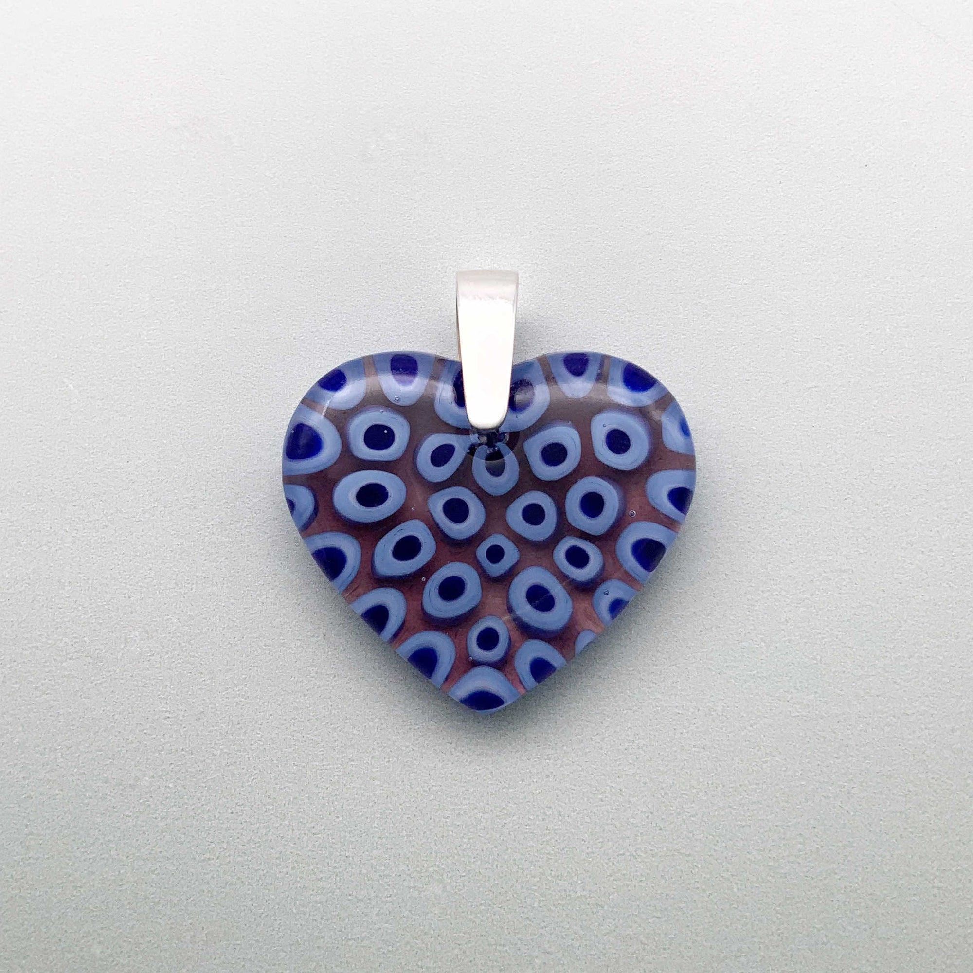 Blue caviar small glass pendant with a plum undertone