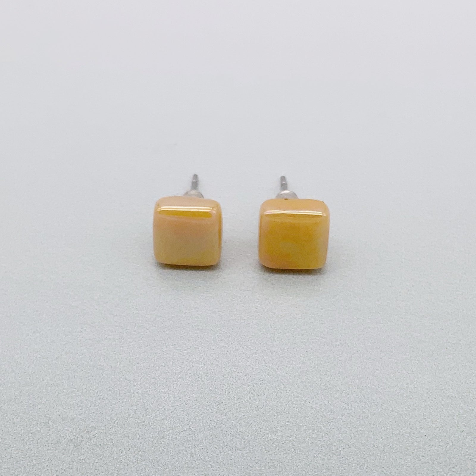 Square spot studs in mustard glass