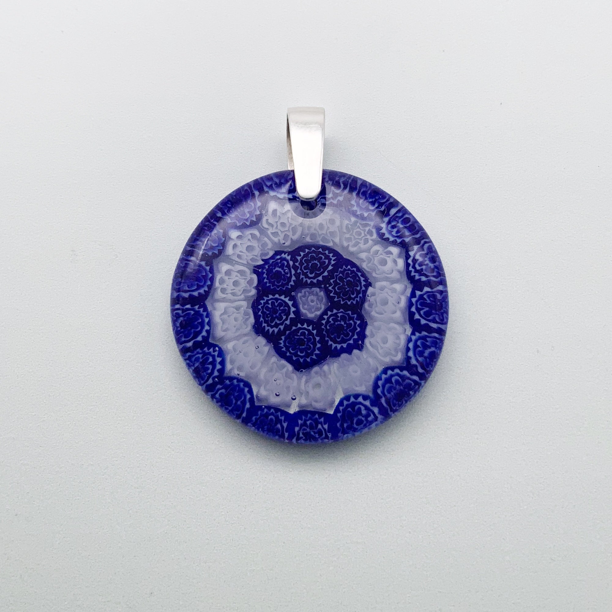 Fused millefiori glass pendant in navy and white fleurettes - 35mm round