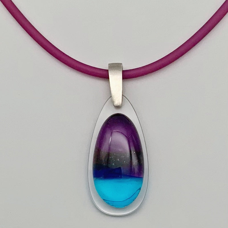 Purple & turquoise drop glass pendant on perspex