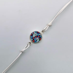 White bracelets with a mix of glass centers